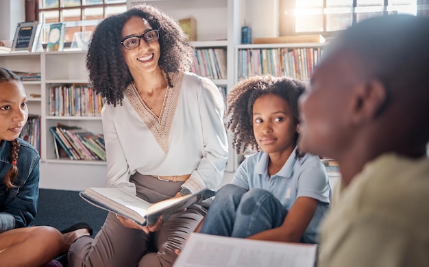 Storytelling teacher or students with talking in a library asking questions for learning development Education kids or children listening to a black woman speaking on fun books at school classroom