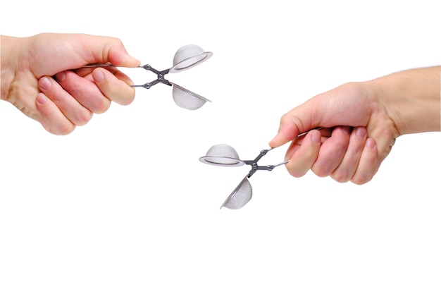 Strainer for brewing tea and sprinkling in your hand on white background