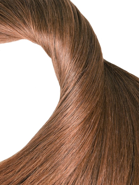 Strand of beautiful soft and healthy brown hair isolated on a white background