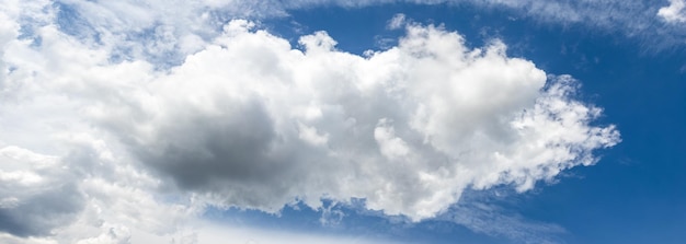 A strange curly white cloud in the blue sky