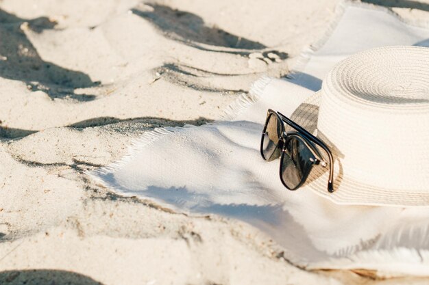 Straw beach hat with brim for sun protection with glasses