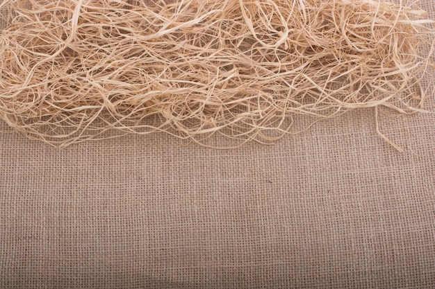 Straw placed on canvas as background