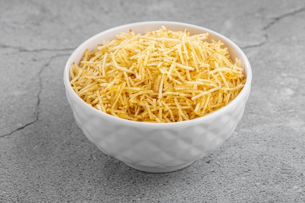 Straw potatoes in a bowl on the table