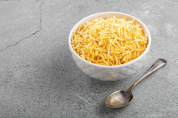 Straw potatoes in a bowl on the table