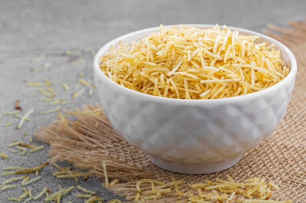 Straw potatoes in a bowl on the table