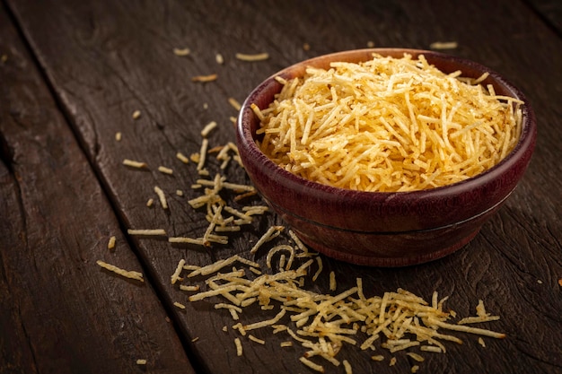 Straw potatoes in a bowl on the table