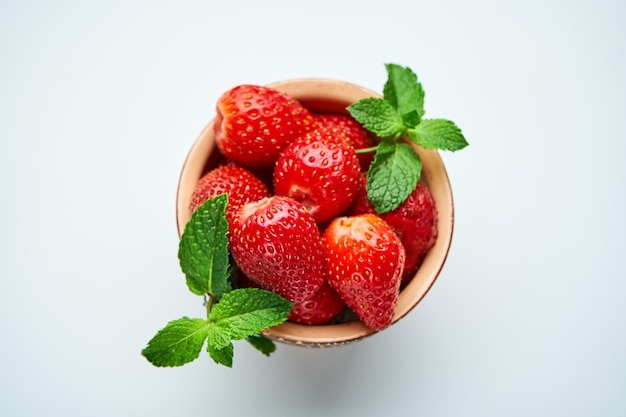 strawberries in a ceramic bowl on top