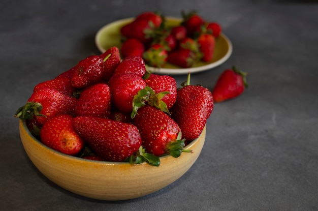 strawberries in fresh fruit closeup with gray background