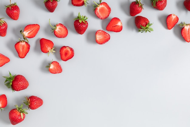 Strawberries on gray background Flat lay top view