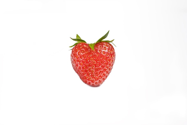 Strawberries isolated Whole strawberries with leaves on a white background