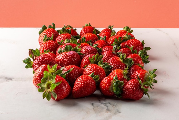 Strawberries on marbled background on gray background