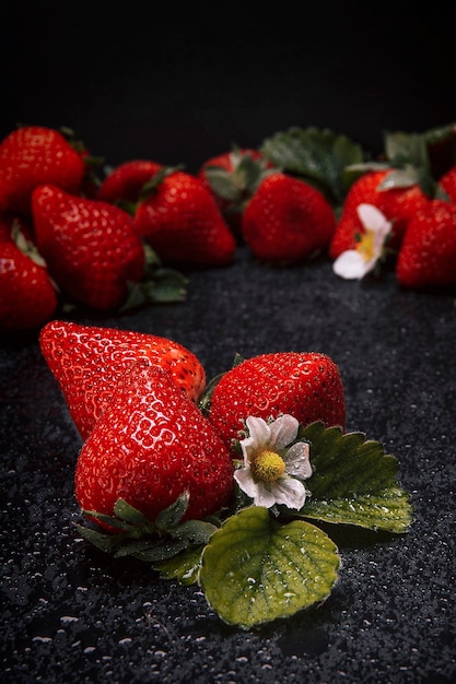 Strawberries on a natural slate base dark food photograhpy