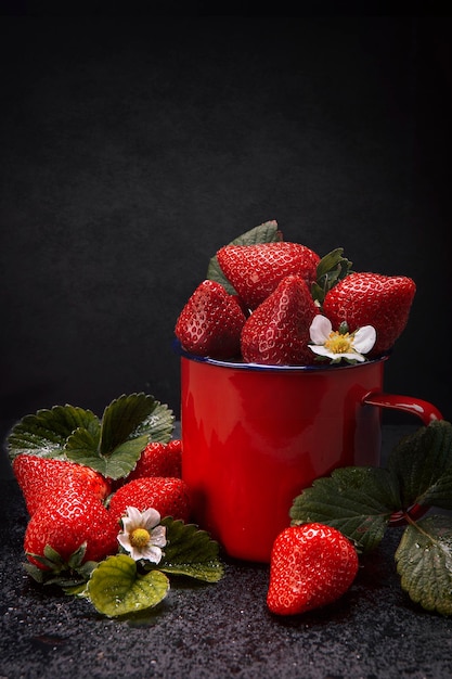 Strawberries on a natural slate base dark food photograhpy