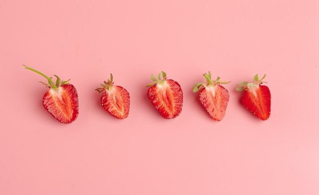 Strawberries on pink . Fresh organic food 