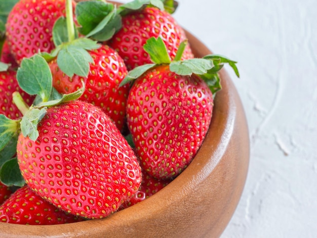 strawberries in wooden bowl