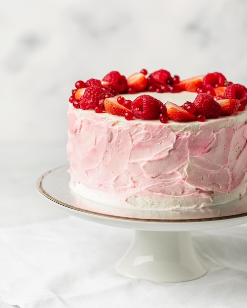 Strawberry cake strawberry sponge cake with fresh strawberries and sour cream on a white background