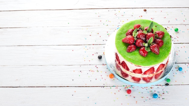 Strawberry Cake On a wooden background Top view Copy space