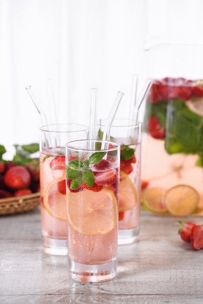 strawberry cocktail or lemonade with basil Cold refreshing organic soft drink with ripe berries