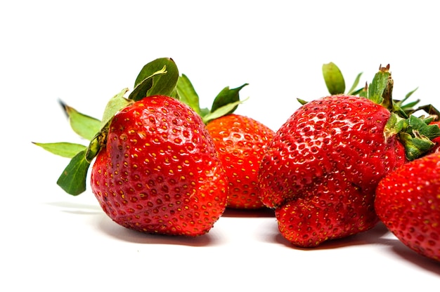 Strawberry fruit closeup isolated on white