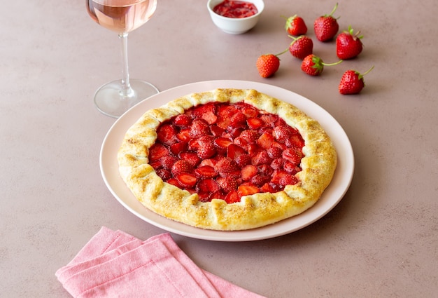 Photo strawberry galette or open pie . baking. vegetarian food.