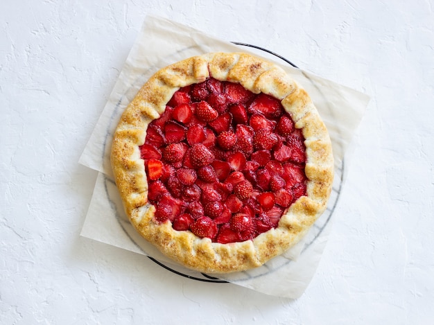 Photo strawberry galette or open pie . baking. vegetarian food.