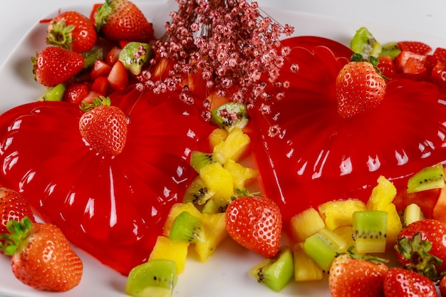 Strawberry gelatin hearts with fresh strawberries and pineapple