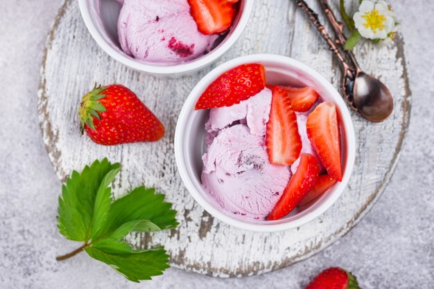 Strawberry ice cream in white bowl