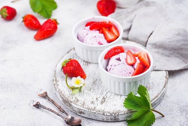 Strawberry ice cream in white bowl