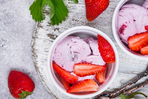 Strawberry ice cream in white bowl