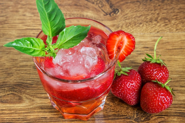 Strawberry iced drink in a wooden table