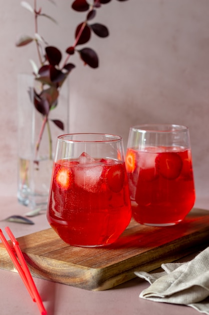 Strawberry lemonade on a pink background . Cold drinks. Summer. Recipe.