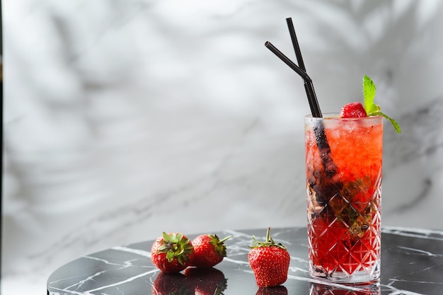 Strawberry mojito with mint leaf on marble table. fresh drinks with strawberry on light background