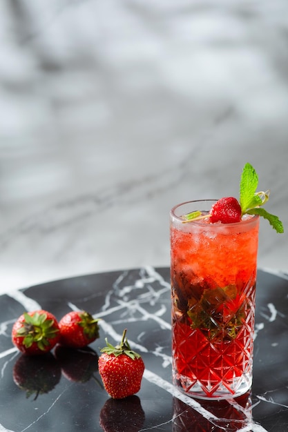 Strawberry mojito with mint leaf on marble table. fresh drinks with strawberry on light background