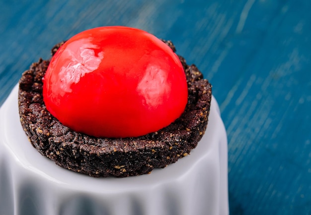 Strawberry Mousse Brownie Mini Cake on blue wood