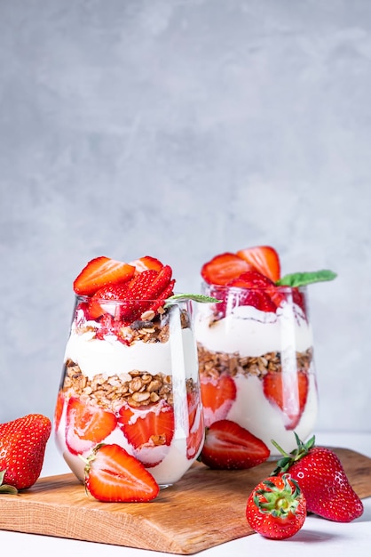 Strawberry parfaits made with fresh fruit yogurt ang granola