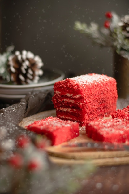 Strawberry piece of cake and red fruit tea, with winter decorations