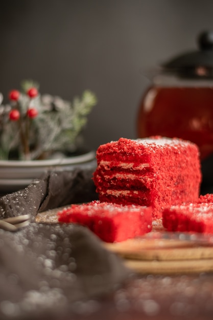 Strawberry piece of cake and red fruit tea, with winter decorations