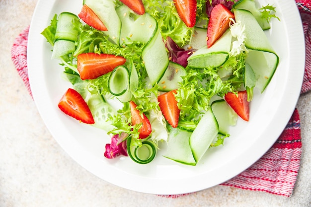 strawberry salad cucumber lettuce healthy meal food snack on the table copy space food background