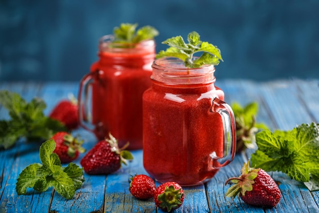 Strawberry smoothie in the glass jars