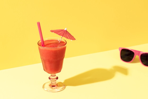 Strawberry smoothie glass and sunglasses