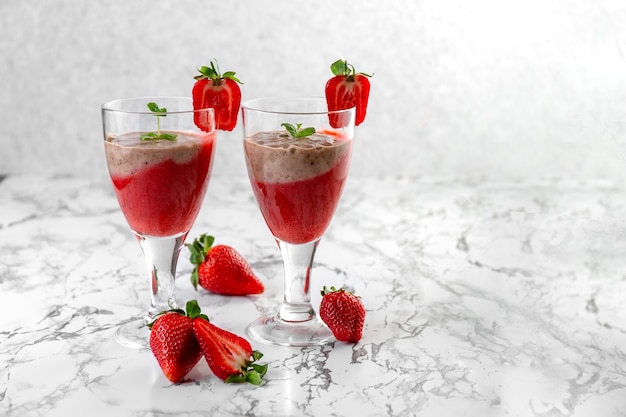 Strawberry and strawberry smoothie strawberry dessert light gray background place for your text copy...