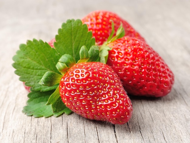 Strawberry on wooden background close up