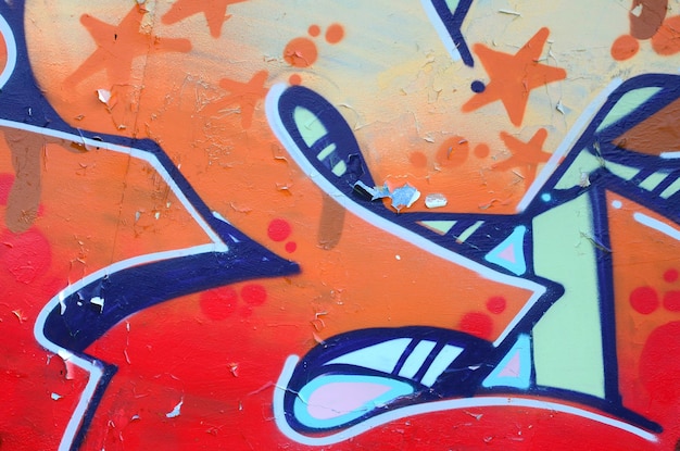 Street art Abstract background image of a fragment of a colored graffiti painting in beige and orange tones