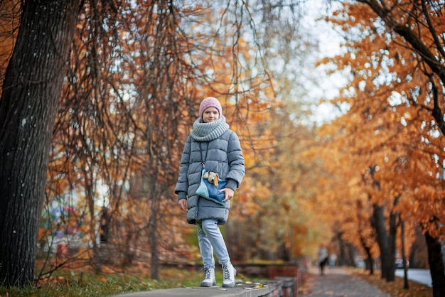 Street autumn portrait of a teenage girl