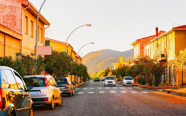 Street Cityscape of car road at Teulada at Carbonia Iglesias at Mediterranean Sea in South Sardinia in Italy. Sardinian Italian small town in Sardegna. Urban district. Cagliari province. Mixed media.