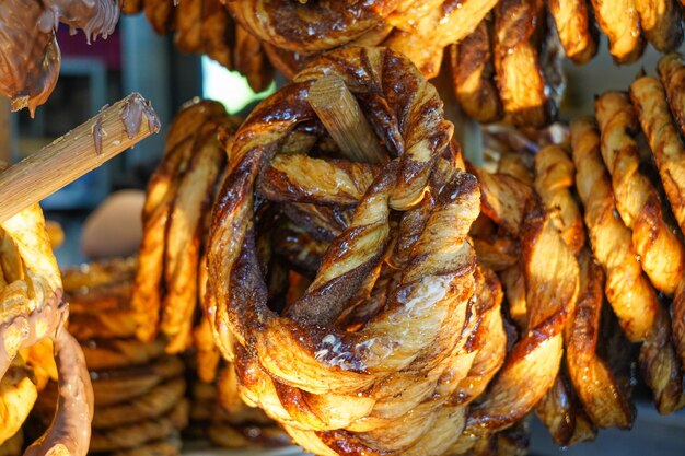 Street food pretzel with chocolate and cinnamon in a cafe