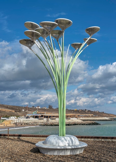 Street lamp in the form of a flower on the seashore