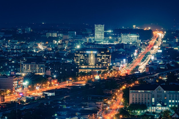 Street lamps at night as long exposure and much traffic on the streets in khonkaen thailand