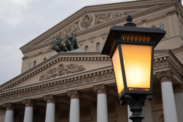 Street lantern in front of facade of Bolshoi theater in Moscow