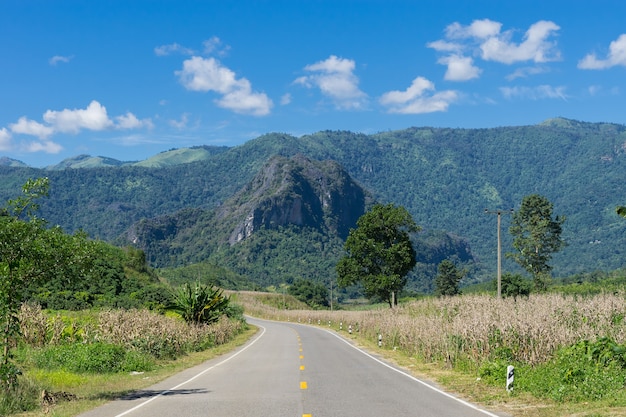 Street and mountain scenery with blue sky background